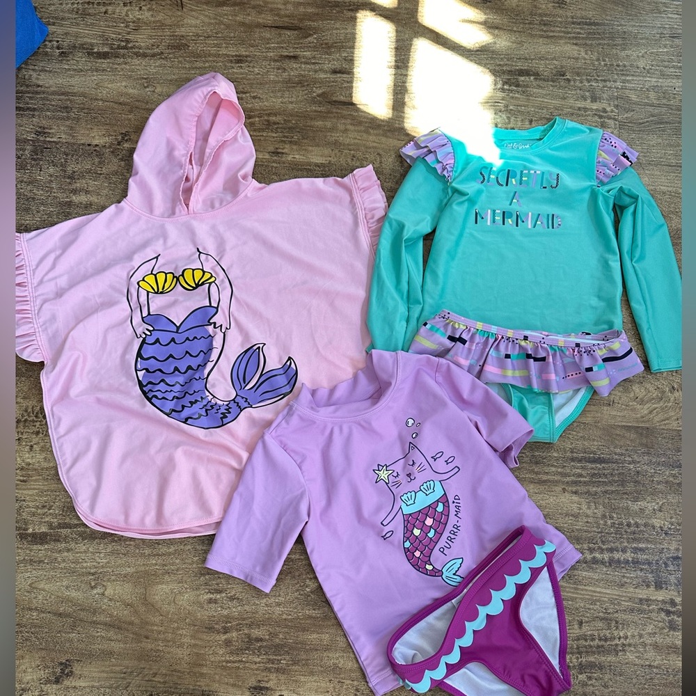 Two swimsuits and one cover up for kids